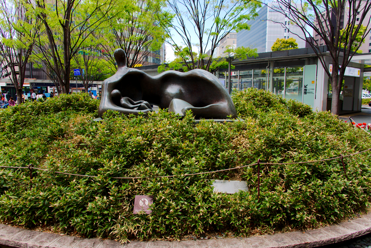 Draped Reclining Mother and Baby at Hakata Station